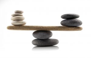 Balancing rocks on wood